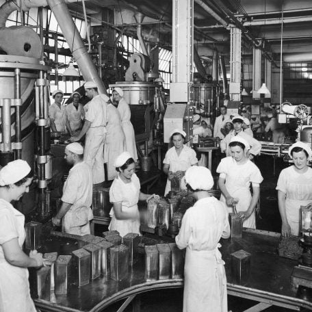 Factory image of women in protective gear - black and white photo